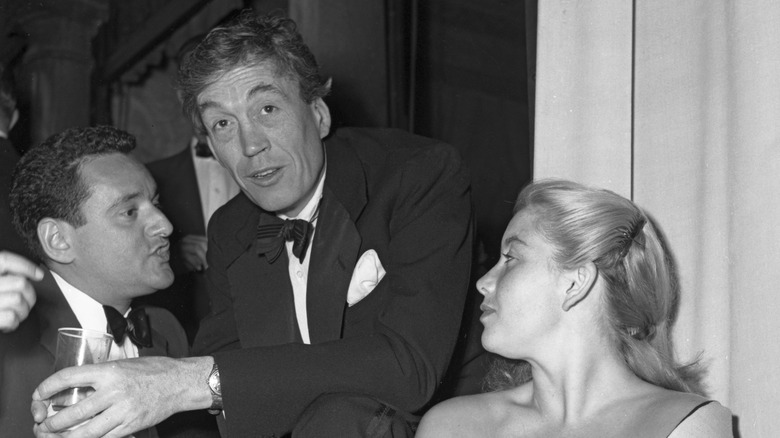 John Huston chatting with a drink in hand