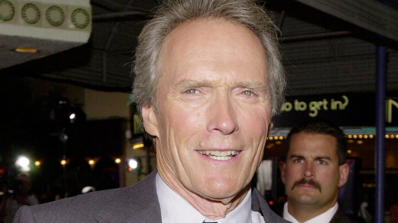 clint eastwood squinting nervous smile