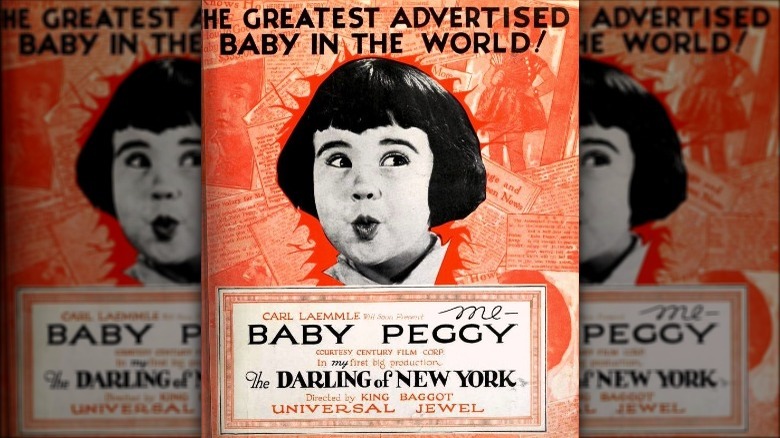 A child actress looks away