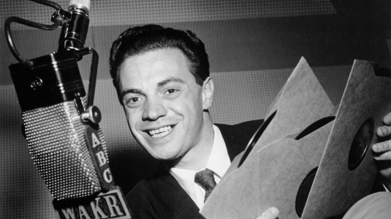 DJ Alan Freed talking into a microphone