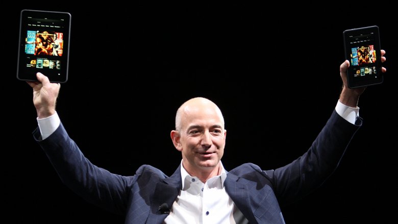 Jeff Bezos holding iPads