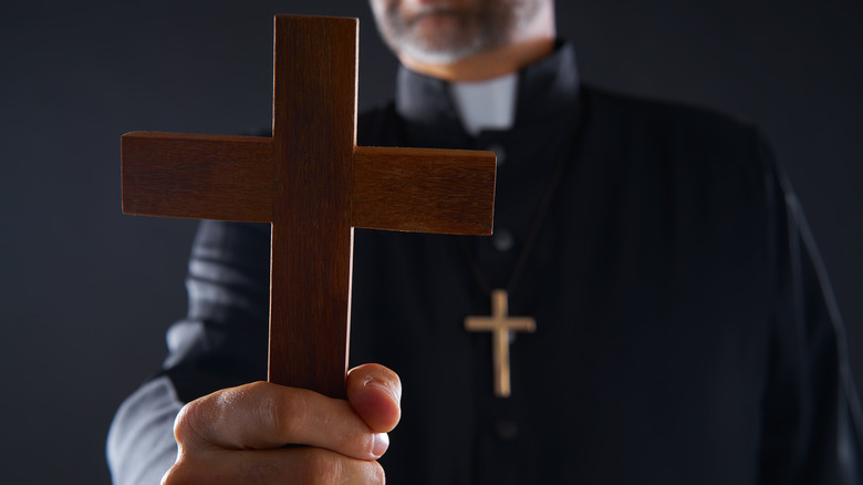 Priest with cross