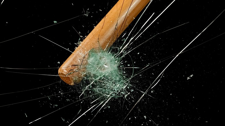 Baseball bat hitting glass