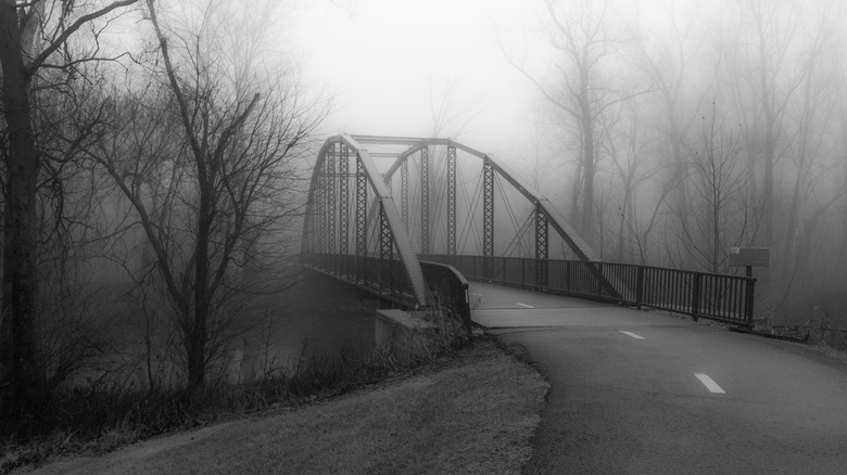 eerie bridge in fog