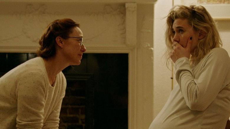 A midwife coaches a pregnant woman