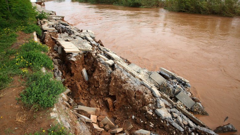 flowing yellow river with rocky embankment