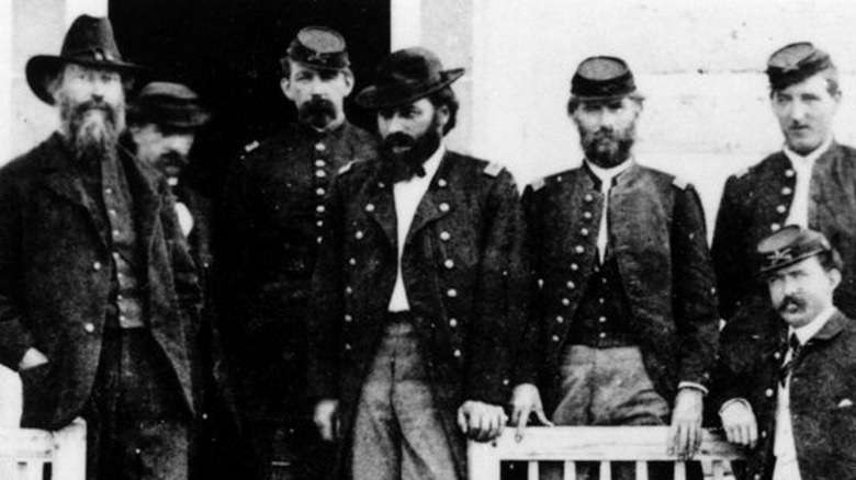 Maj. Eugene Baker standing