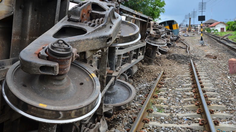 derailed train overturned tracks