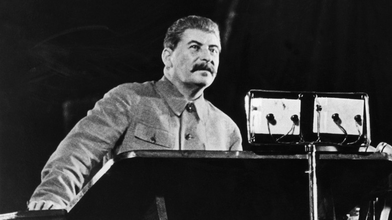 Adolf Hitler yelling into a microphone