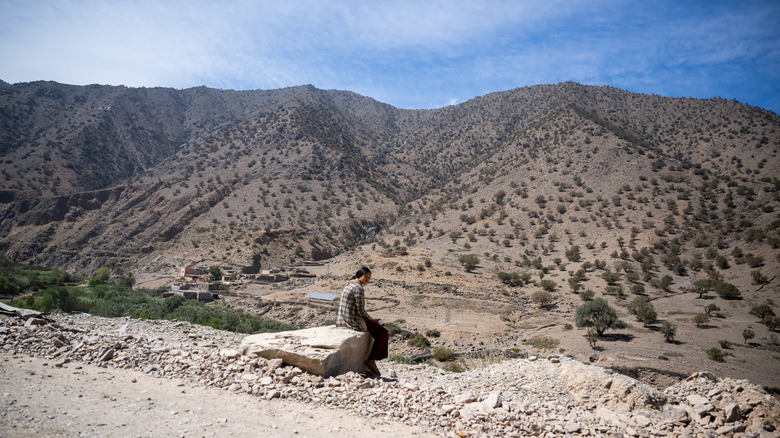 girl sitting on a rock in Morocco
