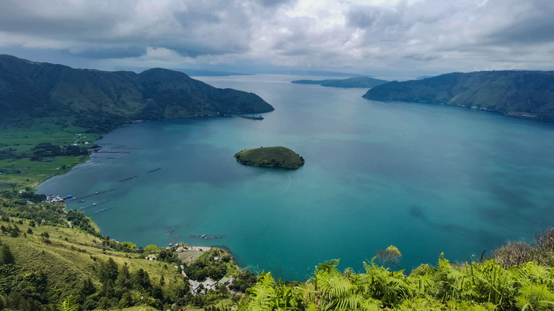 Lake toba caldera blue water cloudy sky