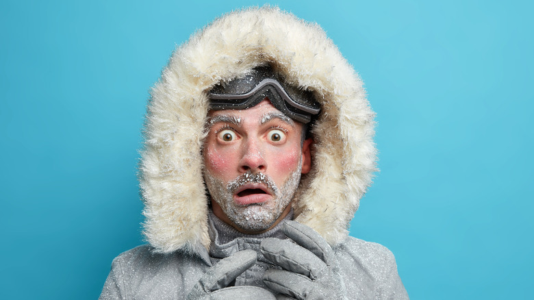 Man with snow on face