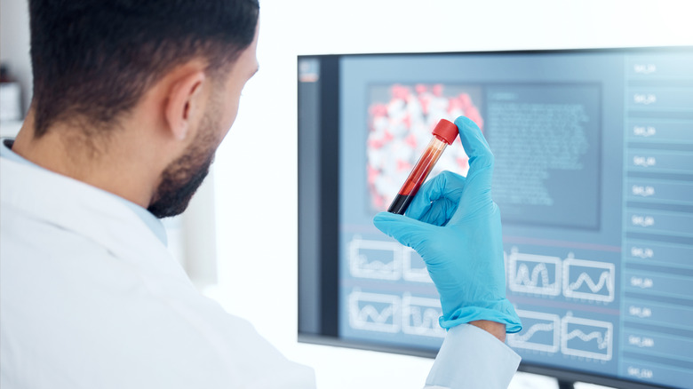 Pathologist conducting blood analysis