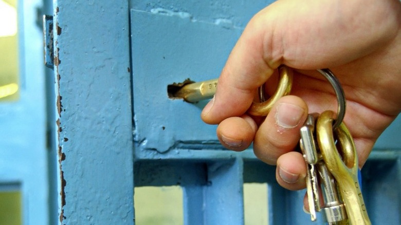 unlocking a prison cell door