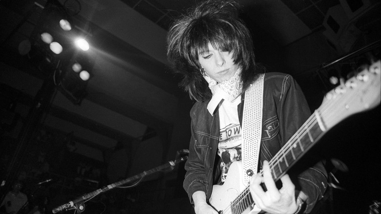 Chrissie Hynde playing guitar