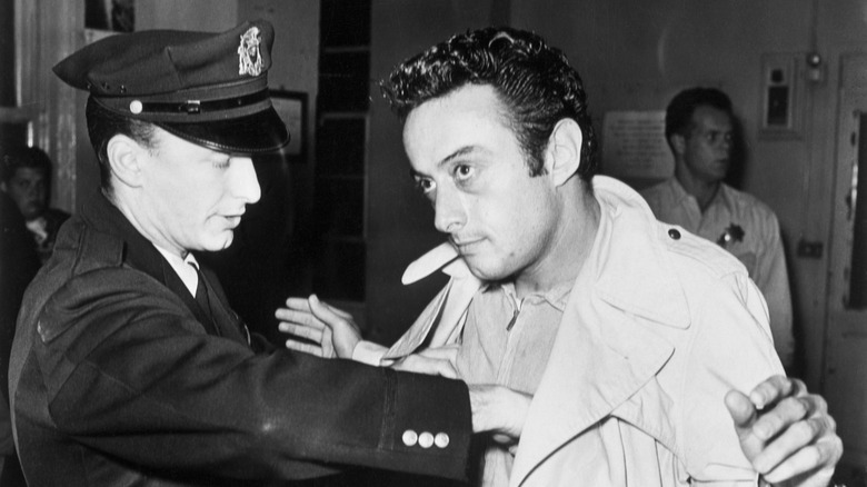 Comedian Lenny Bruce being arrested 