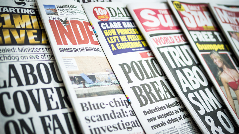 assortment of tabloids lined up 