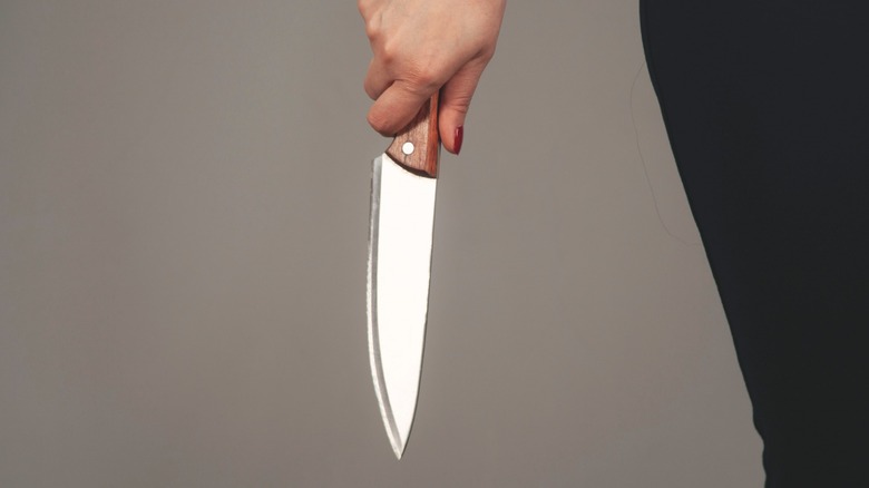 person holding knife