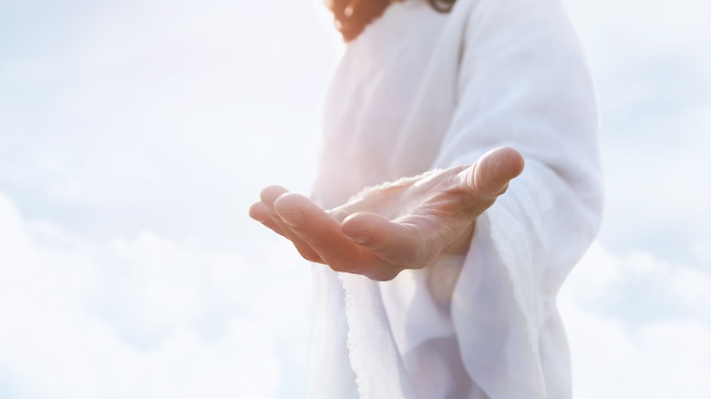 Jesus holding out hand