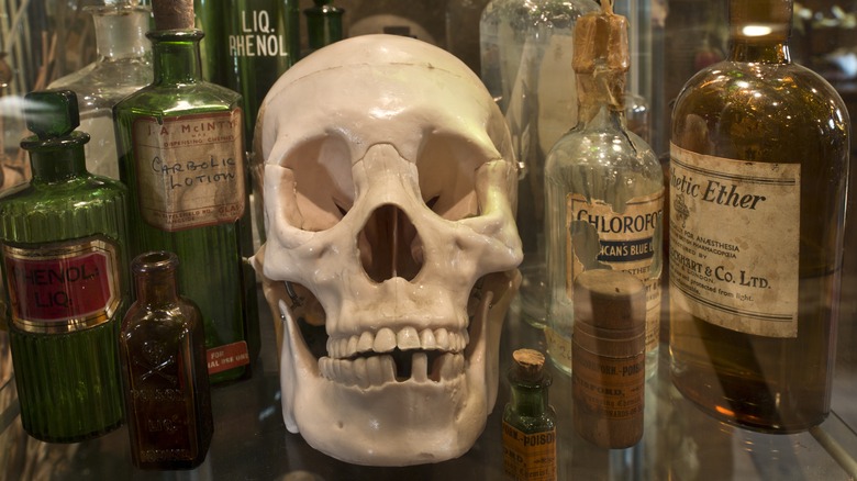 Skull surrounded by medicine bottles 