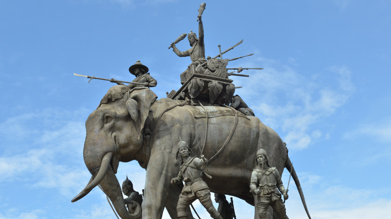 statue of war elephant with riding troops