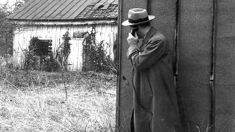 FBI agent with portable telephone