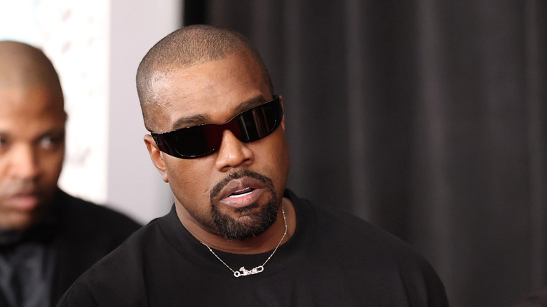 Kanye West wearing sunglasses at the Grammy Awards 2025