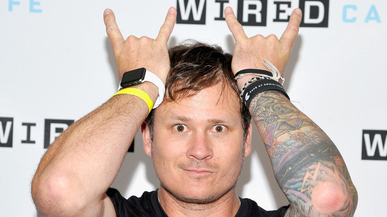 Tom DeLonge posing for a photo