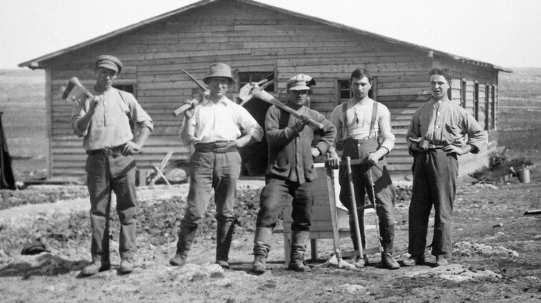 Jewish settlers holding pickaxes