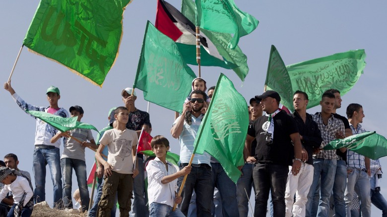 Palestinians waving flags