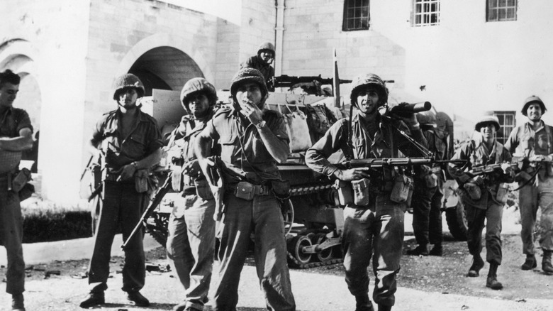 Israeli soldiers near tank
