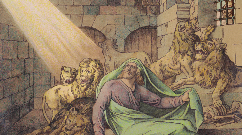 Daniel in lion's den looking up toward ray of sunlight