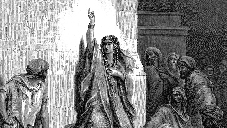 Deborah prophesying with hand raised to crowd