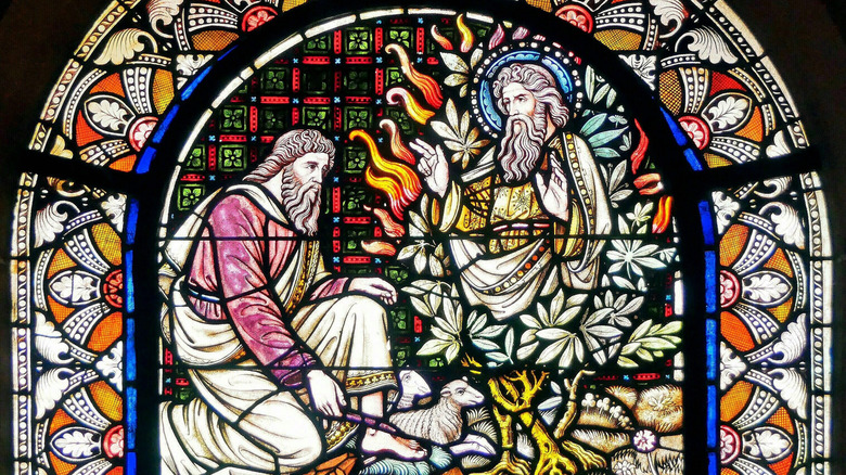 Stained glass depiction of Moses talking to God through the burning bush