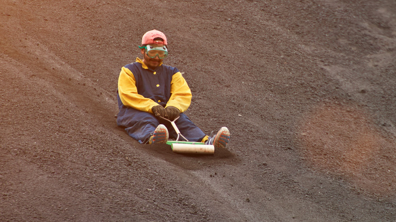 A volcano boarder on their board