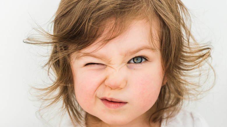 Single eye blink child