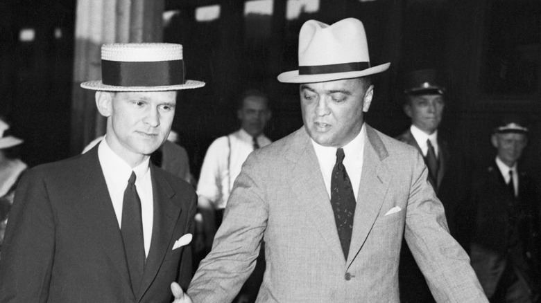 A black-and-white photo of Melvin Purvis and J. Edgar Hoover from the Public Enemy era