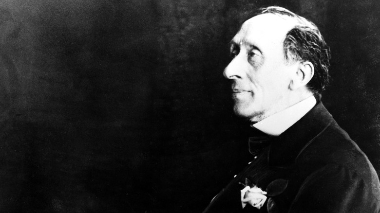 Hans Christian Andersen seated