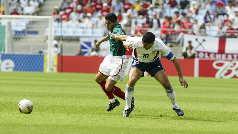 Claudio Reyna and Ramon Morales tussle, 2002