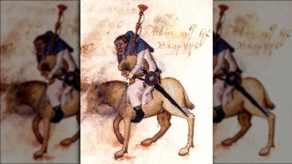 Miniature illustration of Robin, the Miller, with a 16th century note "Robin with the Bagpype" from folio 34v of the Ellesmere Manuscript of Chaucer's Canterbury Tales