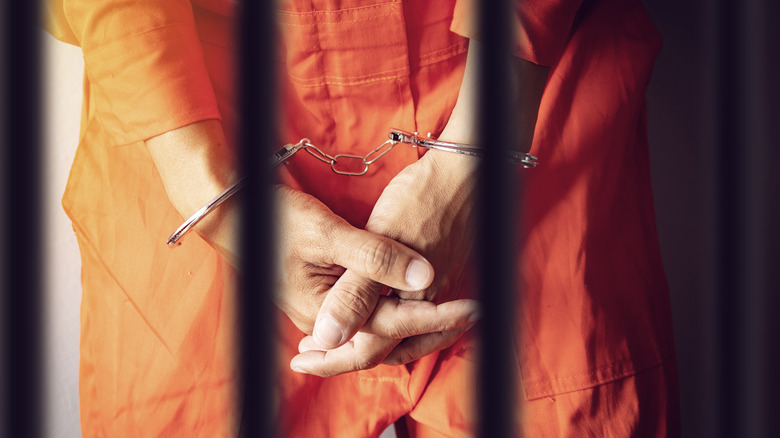 Prisoner behind bars 