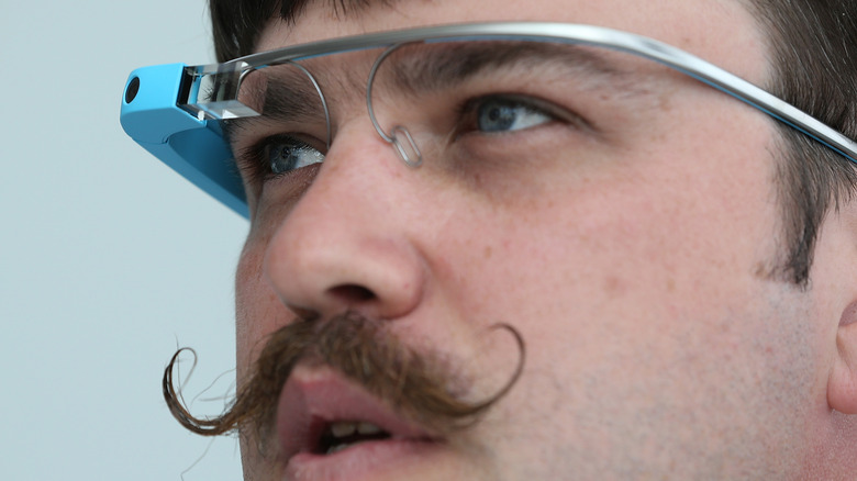 Man with a cool mustache wearing Google Glass