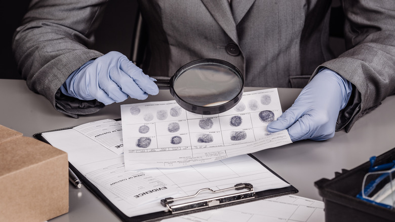 man studying fingerprint