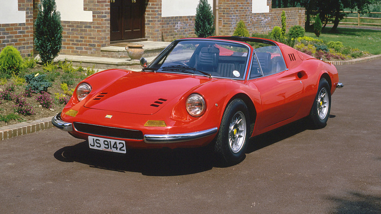 1973 Ferrari Dino 246GTS parked outside a house