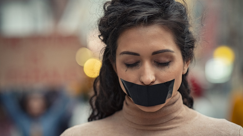 woman silenced