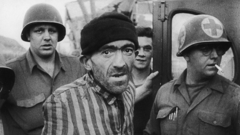 us servicemen and liberated prisoner at dora-mittelbrau camp