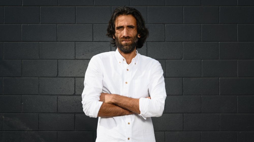 Behrouz Boochani poses during a photo shoot on November 19, 2019 in Christchurch, New Zealand. 