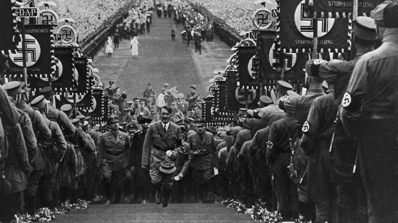Hitler walking up some stairs