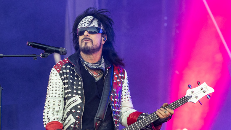 Nikki Sixx playing bass