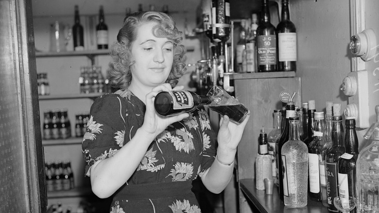 barmaid pouring beer